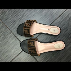 Fendi slides worn several times.